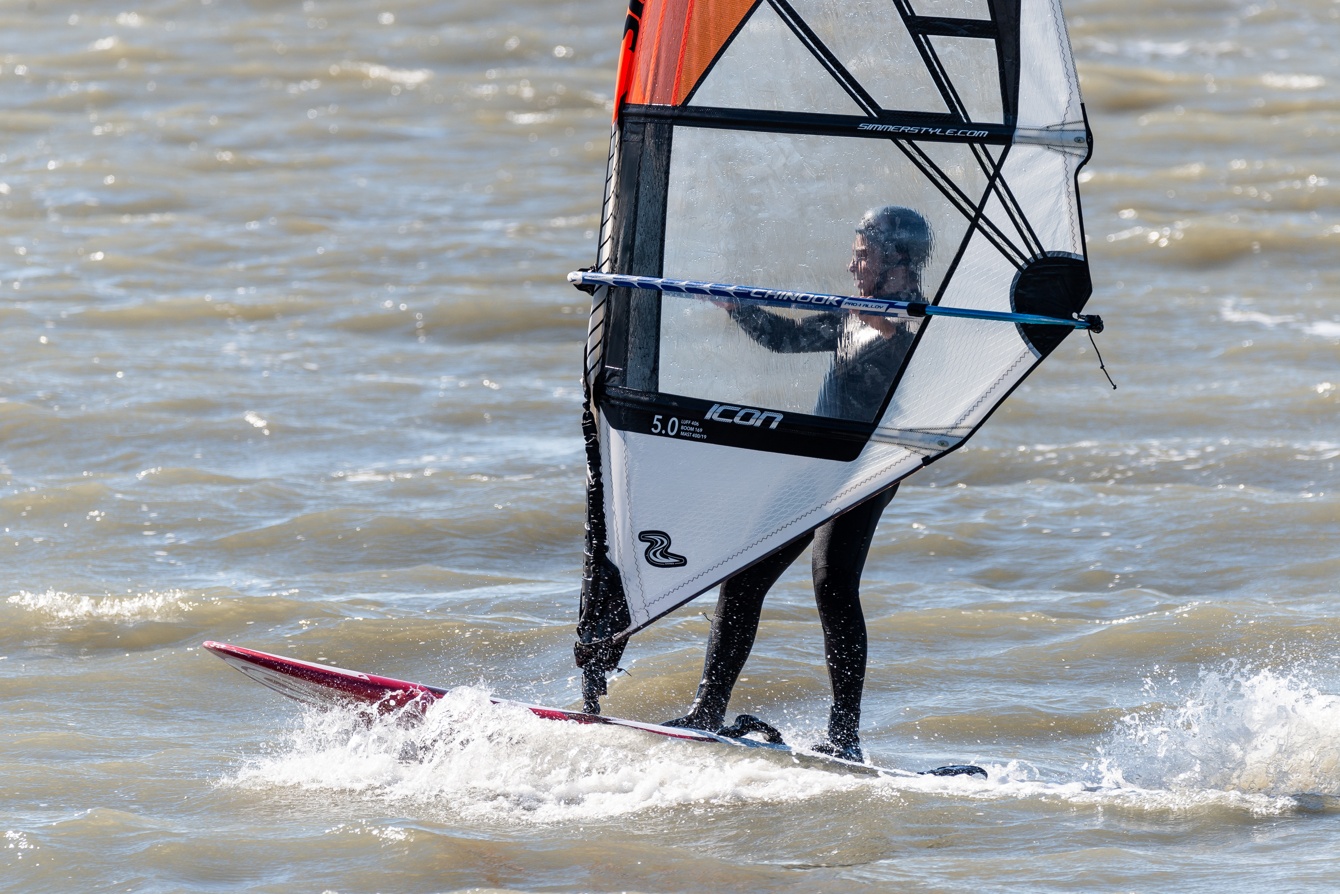 Photographs of people doing various watersports (kite surfing, kite boarding, wind surfing, etc.) at Coyote Point in San Mateo, California (Bay Area) on a clear, beautiful day.
