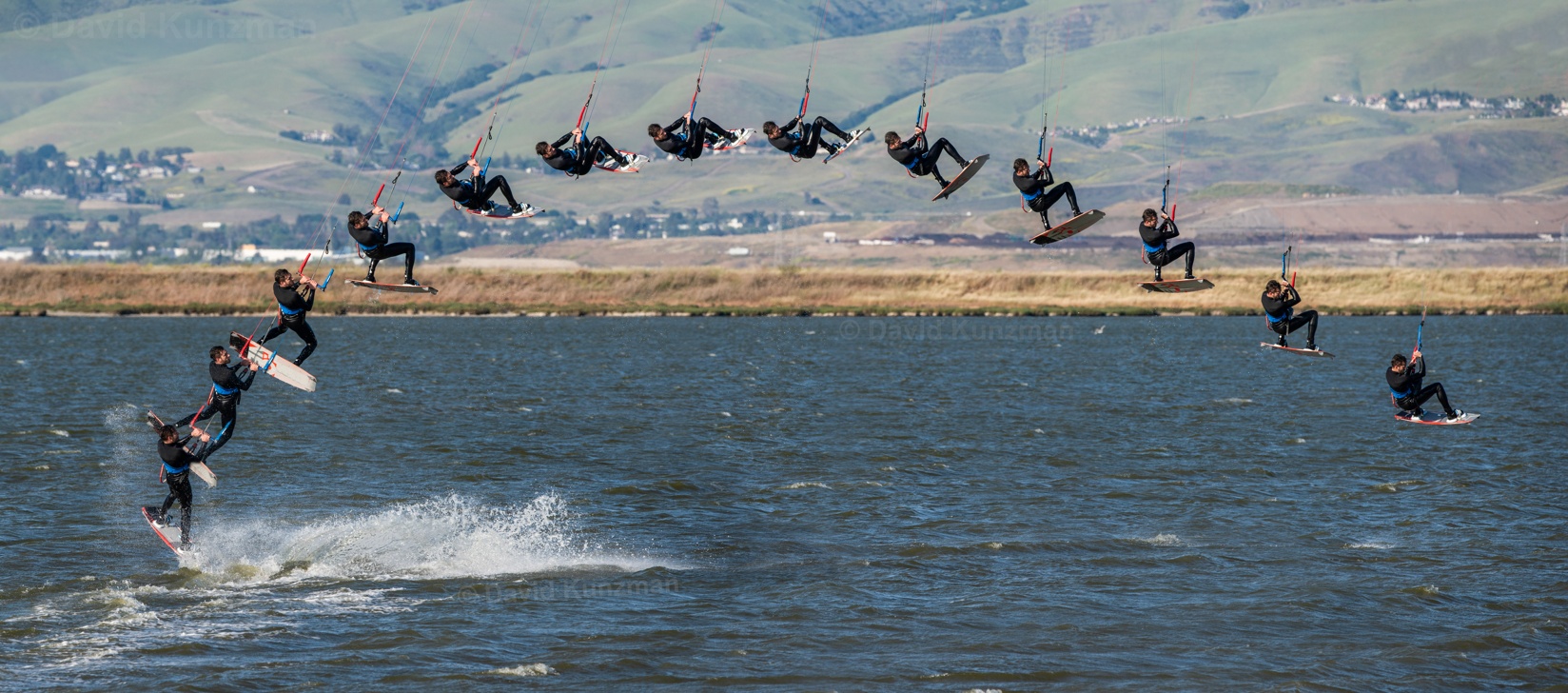 A composite photograph showing a kitesurfer flying high through the air.