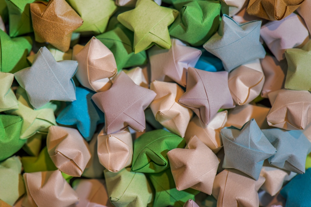 Close up macro photo of colorful origami paper stars.